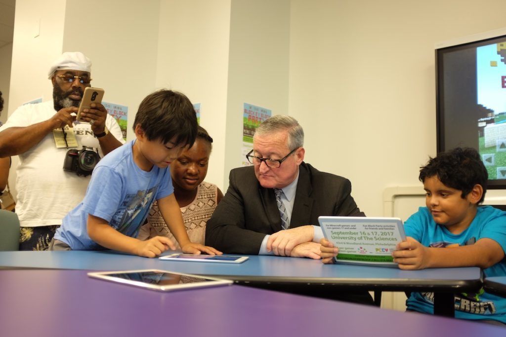 <em>PCCY's Minecraft Leaders Team teaches Mayor Jim Kenney how to play the game. (Courtesy photo)</em>