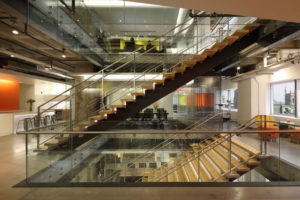 PHMC's headquarters at 1500 Market, with active design elements such as an internal staircase, treadmill desks and natural light.